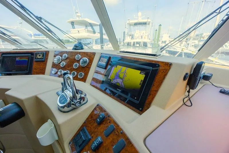  Yacht Photos Pics 2008 Meridian 490 Pilothouse helm with navigation screens and controls.