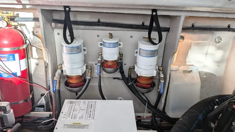  Yacht Photos Pics Engine compartment of 2012 Sea Ray 450 Sundancer with fuel filters and fire extinguisher.