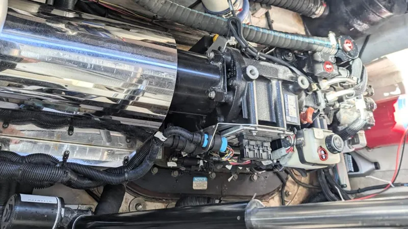  Yacht Photos Pics Engine compartment of a 2012 Sea Ray 450 Sundancer boat, showcasing mechanical components.