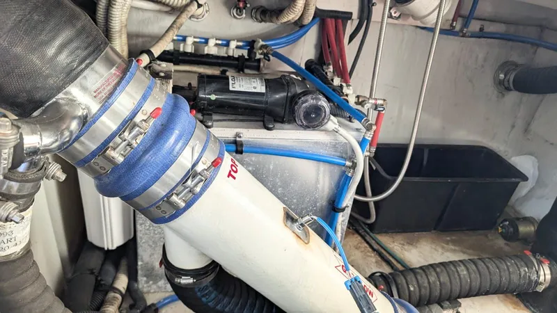  Yacht Photos Pics Engine compartment of a 2012 Sea Ray 450 Sundancer with visible hoses and wiring.