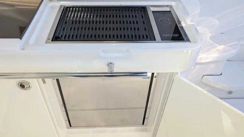  Yacht Photos Pics Outdoor grill and storage on 2012 Sea Ray 450 Sundancer yacht.