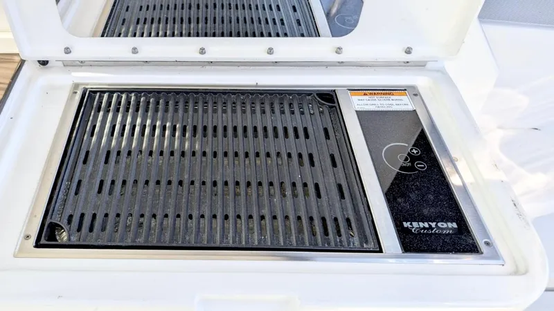  Yacht Photos Pics Built-in Kenyon grill on 2012 Sea Ray 450 Sundancer yacht, featuring sleek design and functionality.