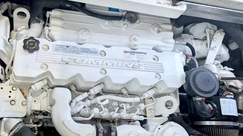  Yacht Photos Pics Cummins engine in a 2012 Sea Ray 450 Sundancer boat, showcasing detailed components.
