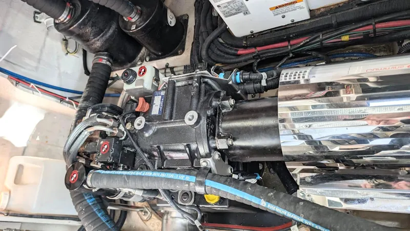  Yacht Photos Pics Engine compartment of a 2012 Sea Ray 450 Sundancer, showcasing mechanical components and wiring.