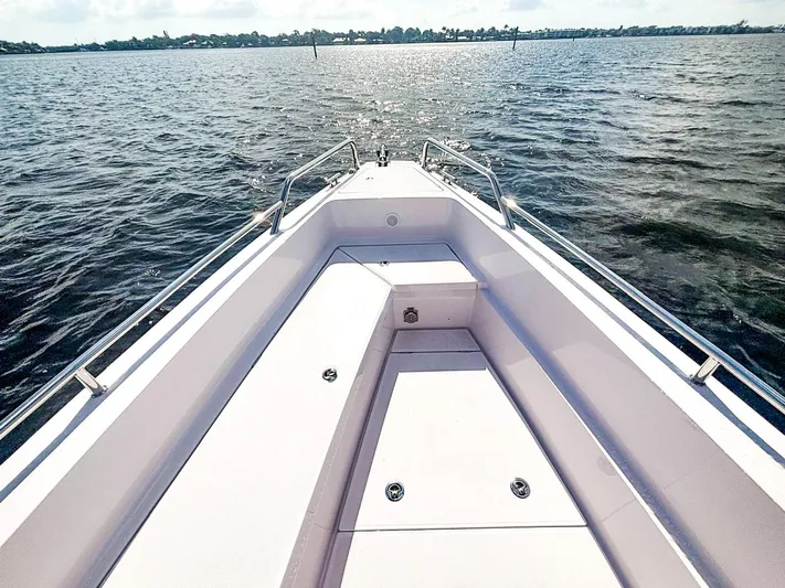  Yacht Photos Pics 2022 Axopar 28 CABIN boat bow view on open water.