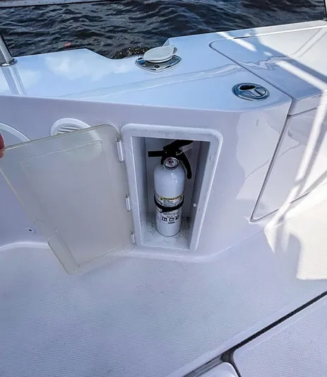  Yacht Photos Pics 2022 Axopar 28 CABIN boat with onboard fire extinguisher compartment.