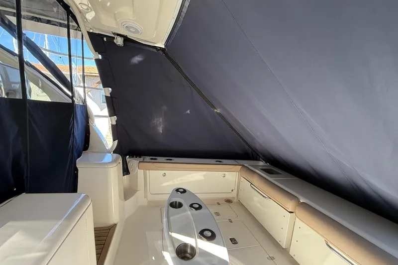  Yacht Photos Pics 2015 Pursuit OS 385 Offshore boat interior with seating and storage.
