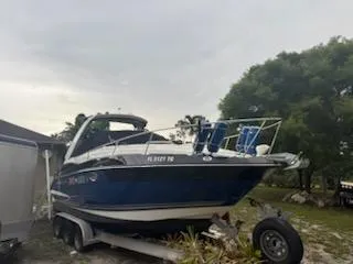  Yacht Photos Pics 2019 Monterey 295 Sport Yacht on trailer, parked outdoors.