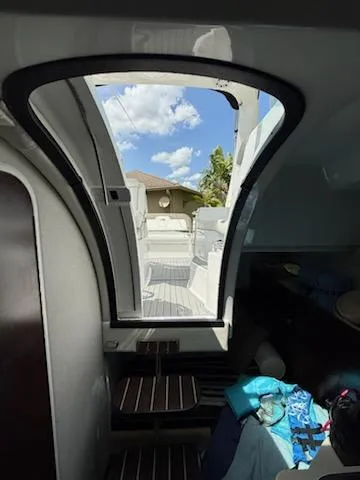  Yacht Photos Pics Interior view of 2019 Monterey 295 Sport Yacht with open hatch and clear sky.