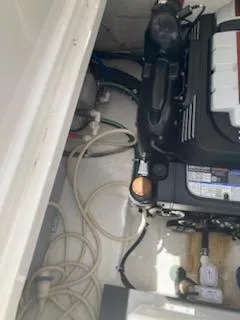  Yacht Photos Pics Engine compartment of a 2019 Monterey 295 Sport Yacht, showing mechanical components and wiring.