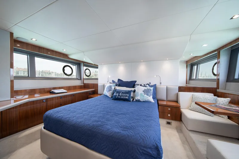 Why Knot Yacht Photos Pics Luxurious bedroom interior of 2020 Sunseeker 52 Manhattan yacht with elegant furnishings.