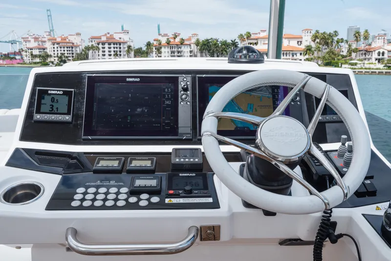 Why Knot Yacht Photos Pics Helm of 2020 Sunseeker 52 Manhattan yacht with advanced navigation systems.