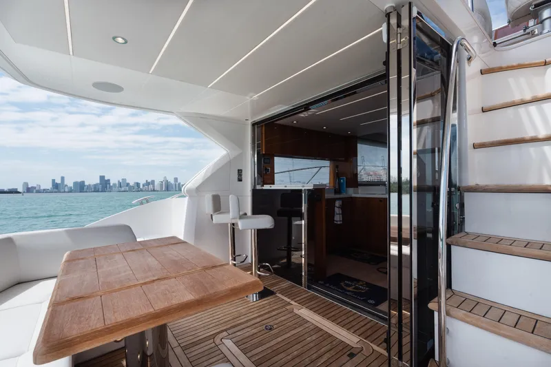 Why Knot Yacht Photos Pics 2020 Sunseeker 52 Manhattan yacht interior with city skyline view.