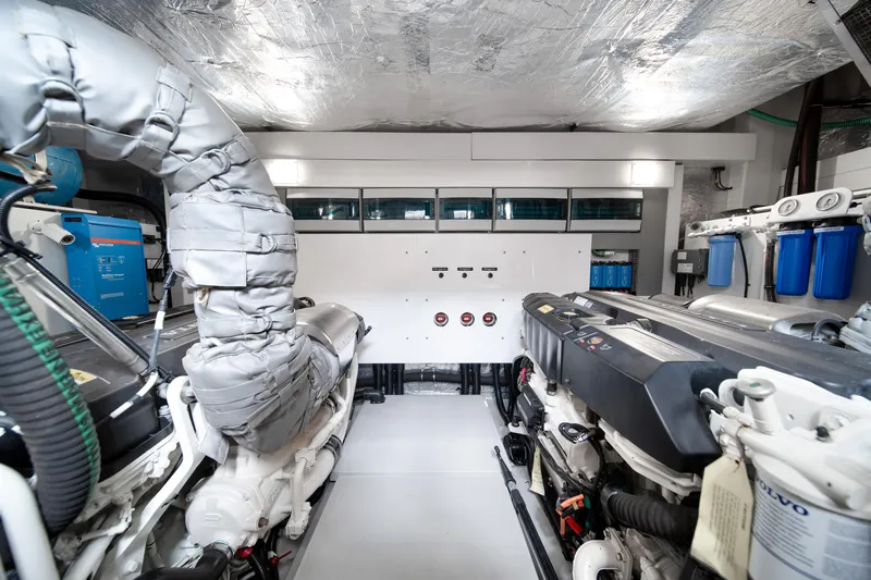 Why Knot Yacht Photos Pics Engine room of 2020 Sunseeker 52 Manhattan yacht, showcasing advanced machinery and equipment.