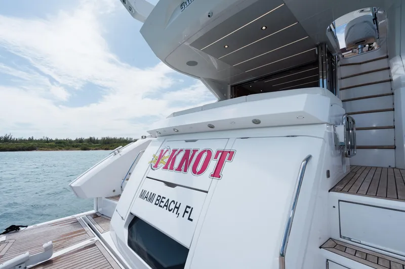 Why Knot Yacht Photos Pics Sunseeker 52 Manhattan yacht, rear view, docked in Miami Beach, Florida, 2020 model.
