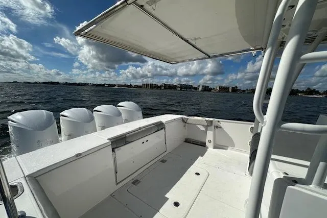  Yacht Photos Pics 2016 Everglades 435 Center Console boat on water, featuring spacious deck and multiple engines.