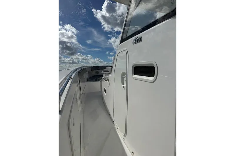  Yacht Photos Pics 2016 Everglades 435 Center Console boat under a partly cloudy sky.