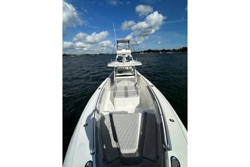  Yacht Photos Pics 2016 Everglades 435 Center Console boat on open water under blue sky.