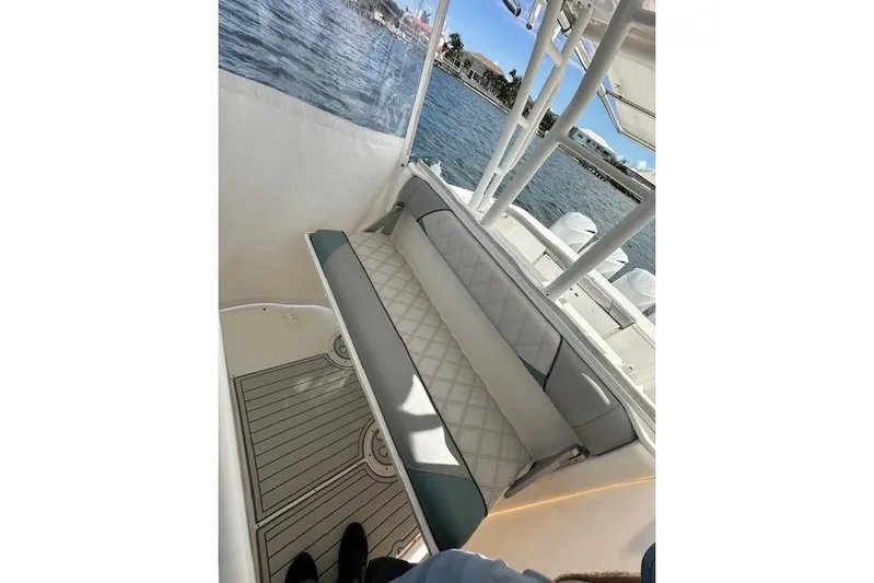  Yacht Photos Pics 2016 Everglades 435 Center Console boat interior with cushioned seating and ocean view.
