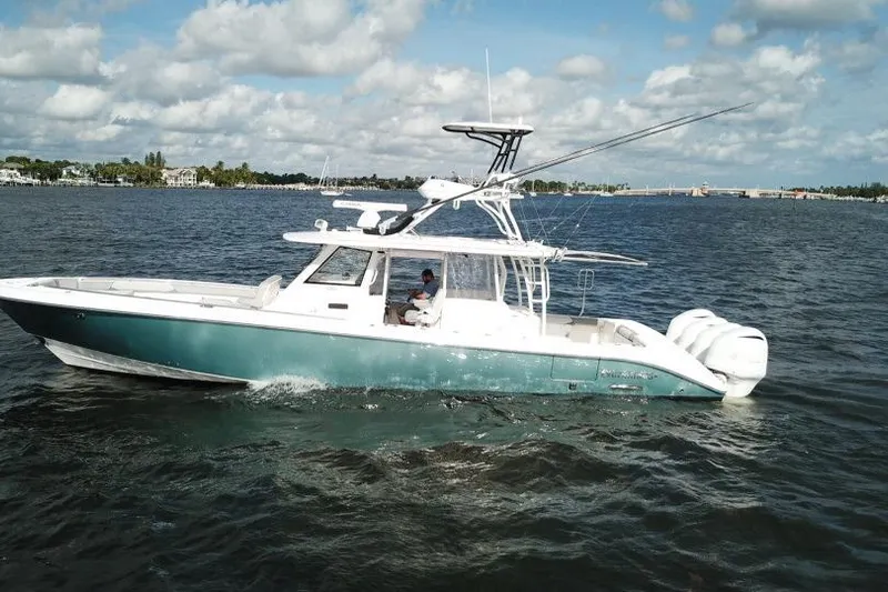  Yacht Photos Pics 2016 Everglades 435 Center Console boat cruising on a sunny day.