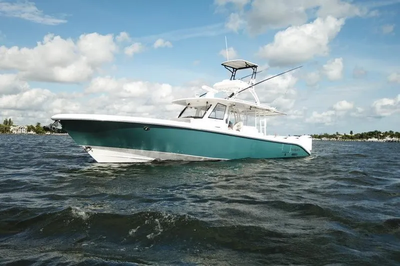  Yacht Photos Pics 2016 Everglades 435 Center Console boat on open water under blue sky.