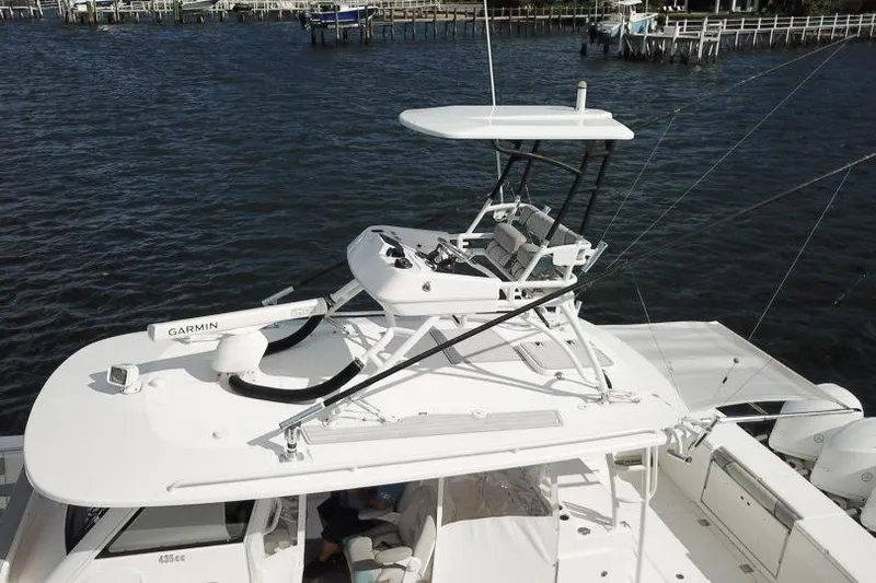 Yacht Photos Pics 2016 Everglades 435 Center Console boat with upper helm, on water.