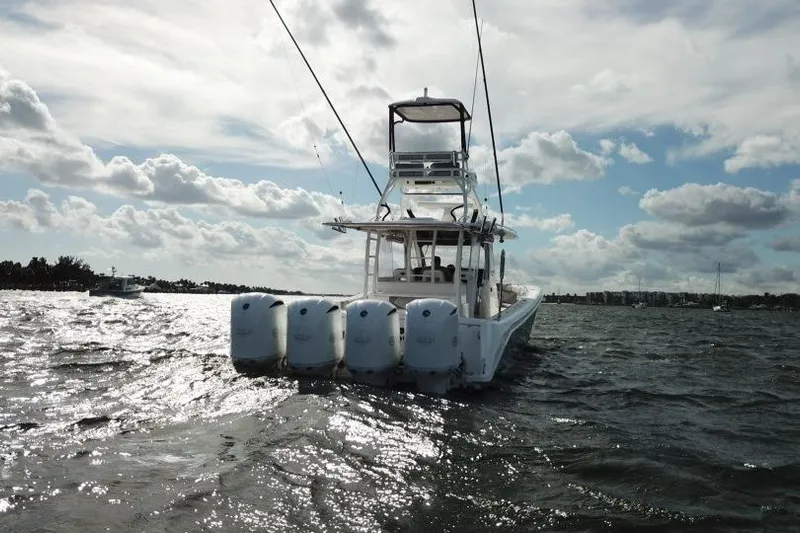 Yacht Photos Pics 2016 Everglades 435 Center Console boat on choppy water under cloudy sky.