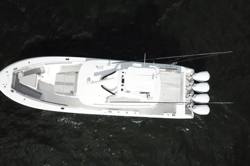  Yacht Photos Pics Overhead view of 2016 Everglades 435 Center Console boat on dark water.