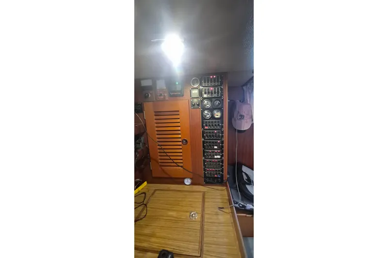  Yacht Photos Pics Electrical panel inside a 1986 Hallberg-Rassy 49 sailboat, featuring gauges and switches.