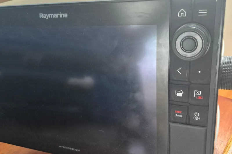  Yacht Photos Pics Raymarine navigation system on 1986 Hallberg-Rassy 49 yacht, featuring HybridTouch interface.