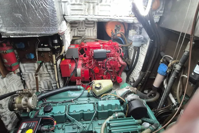 Yacht Photos Pics Engine room of a 1986 Hallberg-Rassy 49 yacht with visible machinery and components.