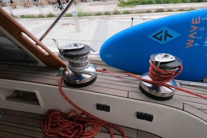  Yacht Photos Pics Deck of 1986 Hallberg-Rassy 49 sailboat with winches and coiled ropes.