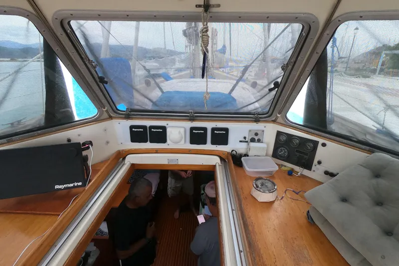  Yacht Photos Pics Interior view of 1986 Hallberg-Rassy 49 sailboat cockpit with navigation equipment.