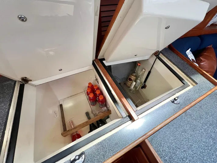 Vela Dare II Yacht Photos Pics Built-in coolers on a 1999 Sabre 402 yacht with beverages inside.