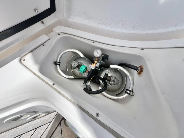 Vela Dare II Yacht Photos Pics Propane tank storage compartment on a 1999 Sabre 402 sailboat.