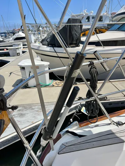 Vela Dare II Yacht Photos Pics Close-up of a 1999 Sabre 402 sailboat docked at a marina.