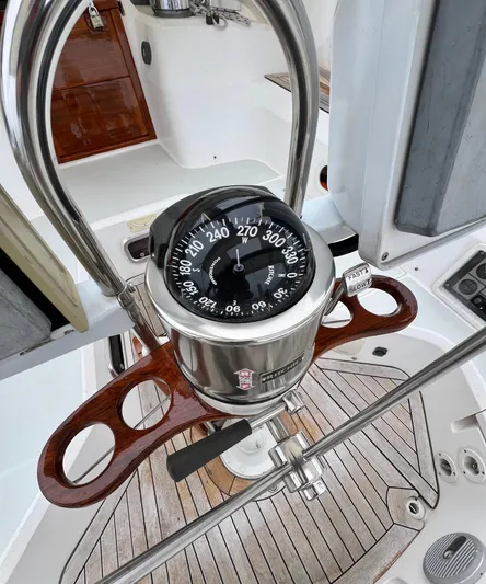 Vela Dare II Yacht Photos Pics 1999 Sabre 402 yacht compass and steering wheel in cockpit.