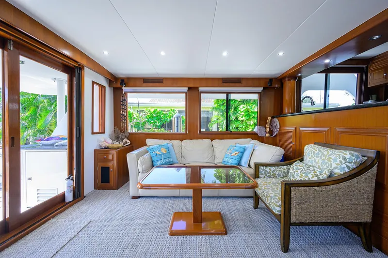 Change Of Latitude Yacht Photos Pics Luxurious interior of 2001 Ocean Alexander 602 yacht with elegant seating and wooden accents.