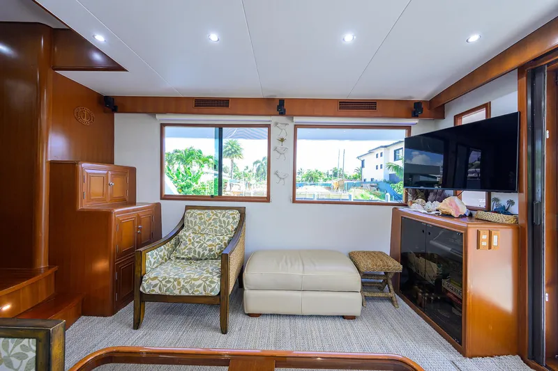 Change Of Latitude Yacht Photos Pics Luxurious interior of 2001 Ocean Alexander 602 yacht with elegant seating and large windows.