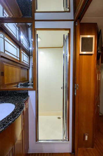 Change Of Latitude Yacht Photos Pics Luxurious bathroom interior of 2001 Ocean Alexander 602 yacht with granite countertop and shower.