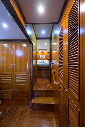 Change Of Latitude Yacht Photos Pics Luxurious wooden interior of 2001 Ocean Alexander 602 yacht cabin hallway.