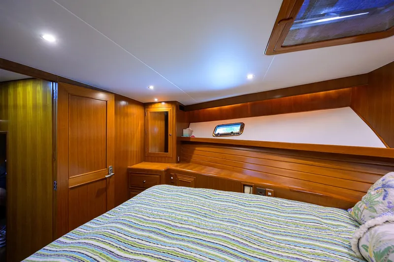 Change Of Latitude Yacht Photos Pics Luxurious wooden cabin interior of 2001 Ocean Alexander 602 yacht.