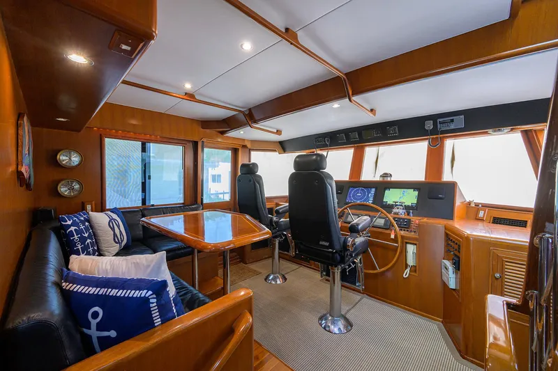 Change Of Latitude Yacht Photos Pics Luxurious 2001 Ocean Alexander 602 yacht interior with helm, seating, and nautical decor.