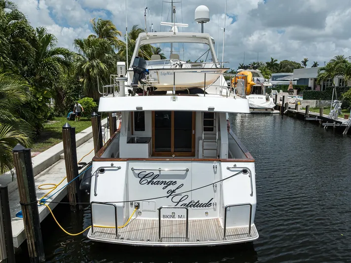 Change Of Latitude Yacht Photos Pics Ocean Alexander 602 yacht docked, rear view, "Change of Latitude," 2001 model, tropical setting.