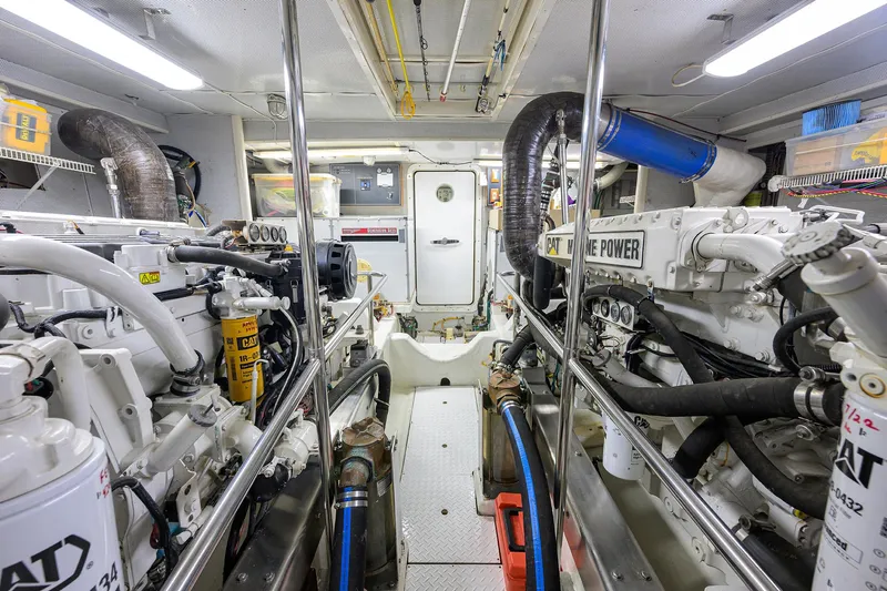 Change Of Latitude Yacht Photos Pics Engine room of 2001 Ocean Alexander 602 yacht, featuring dual CAT marine engines.