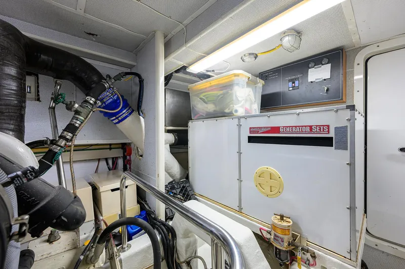 Change Of Latitude Yacht Photos Pics Engine room of 2001 Ocean Alexander 602 yacht with generator and equipment.