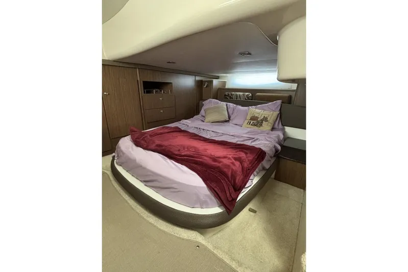 Bad Boy VI Yacht Photos Pics Luxurious bedroom interior of 2016 Meridian 441 Sedan yacht with cozy bedding.