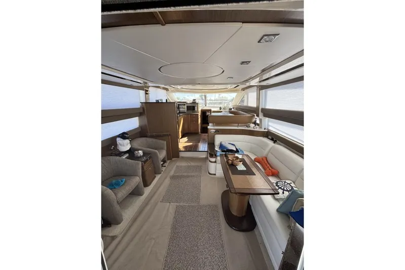 Bad Boy VI Yacht Photos Pics Luxurious interior of a 2016 Meridian 441 Sedan yacht with elegant seating and modern amenities.