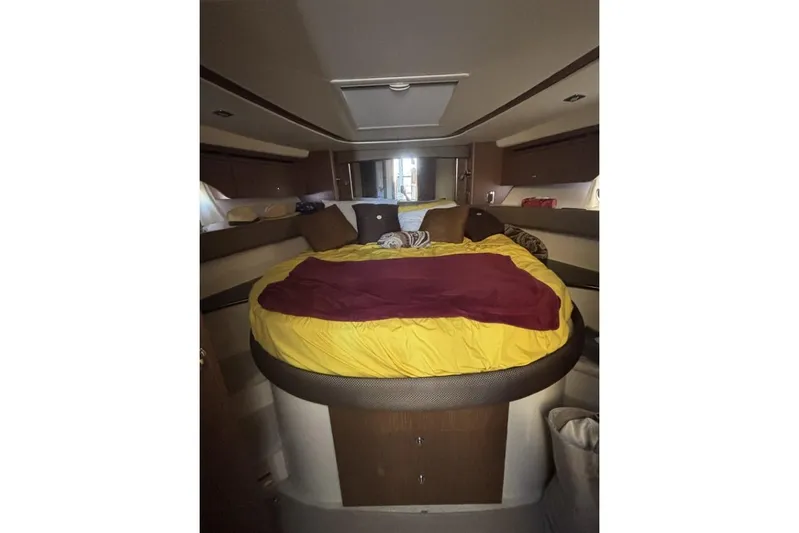 Bad Boy VI Yacht Photos Pics Interior cabin of 2016 Meridian 441 Sedan yacht with cozy bed setup.