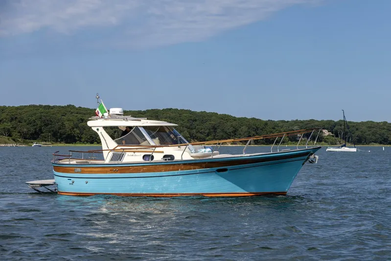  Yacht Photos Pics 2022 Fratelli Aprea 32 Hard Top boat on calm water, scenic background.